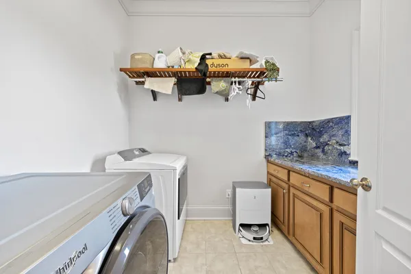 a kitchen that has a sink a stove and a wooden floor