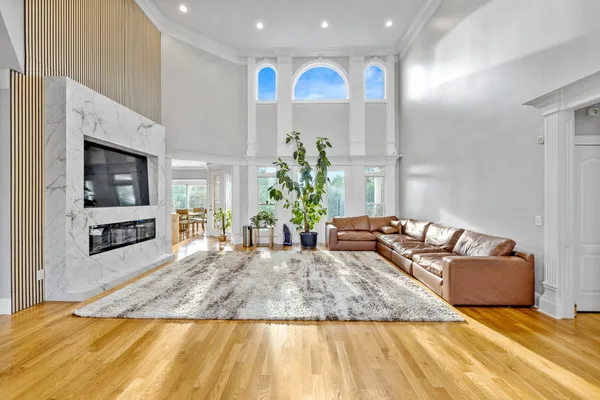 a living room with kitchen island granite countertop furniture and a fireplace