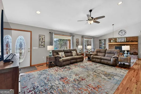 a living room with furniture and a window