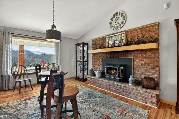 a living room with furniture a window and a fireplace