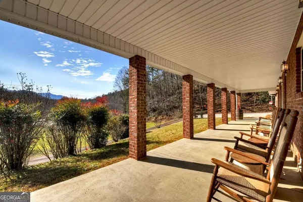 a view of swimming pool with an outdoor seating