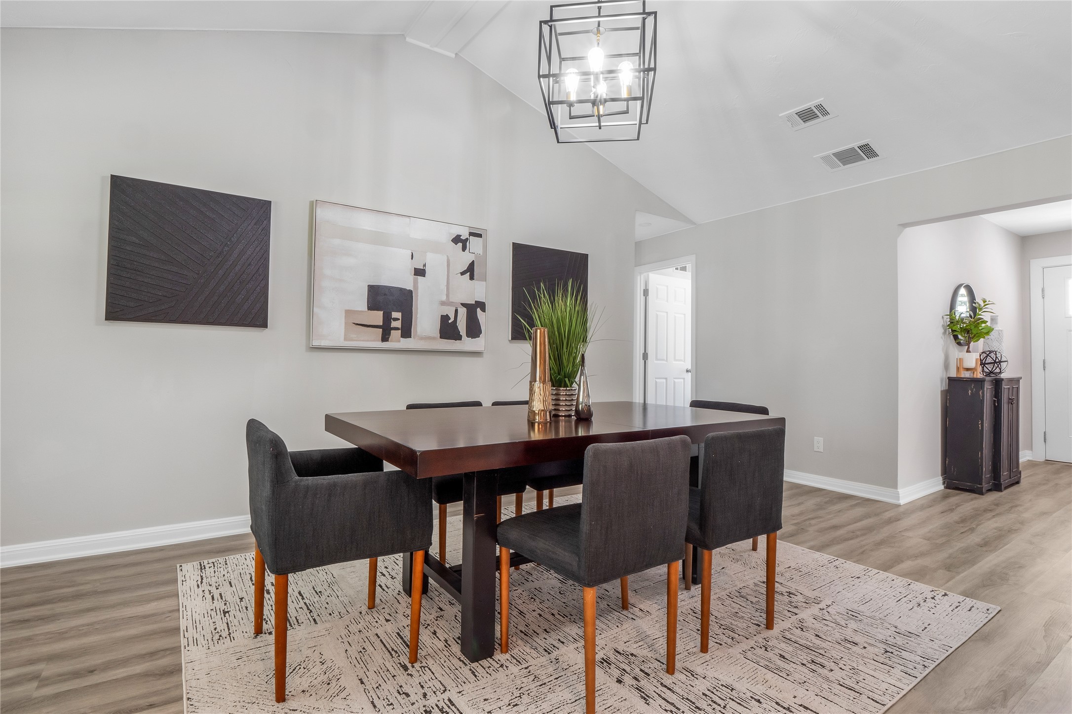 8007 Colony Loop Drive Austin, TX 78724 - Photo 29 of 40 Vaulted dining room with modern chandelier and open feel for gatherings and entertaining.