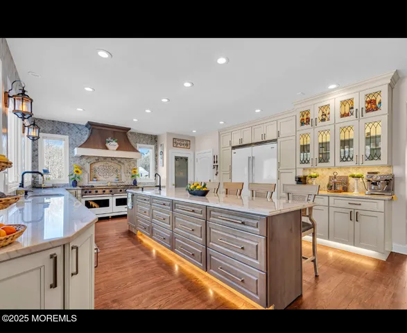 a kitchen with sink refrigerator and stove