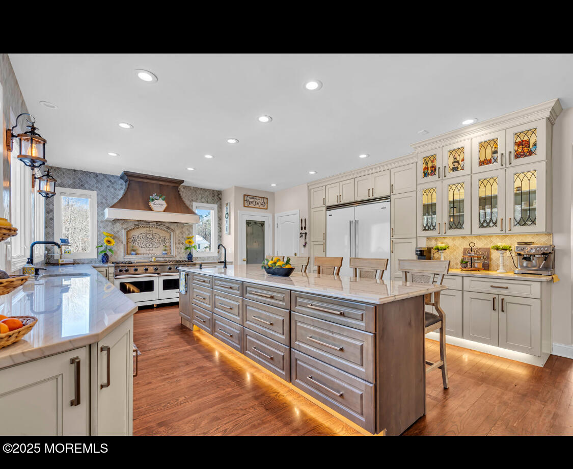 a kitchen with sink refrigerator and stove