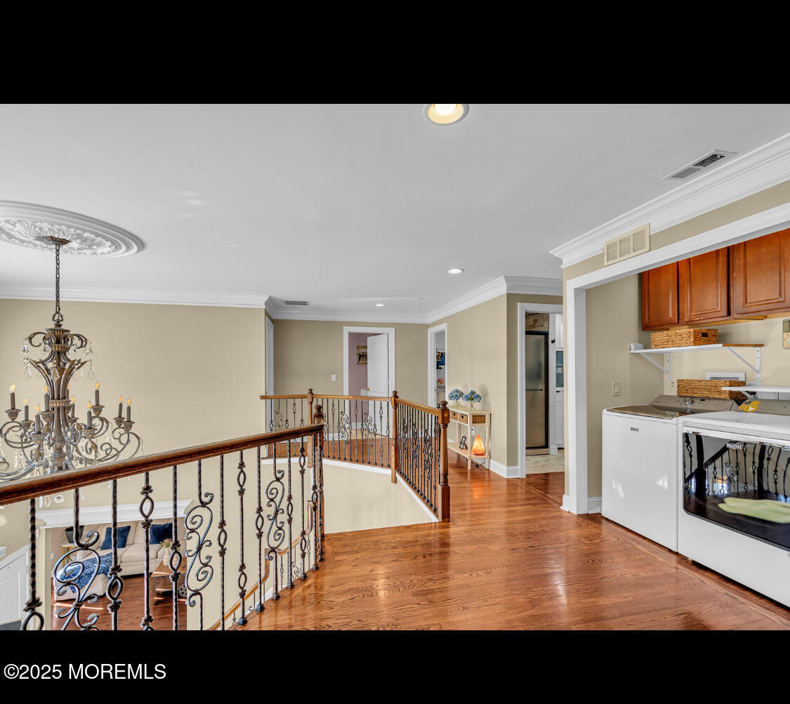 9 Mehar Court Jackson, NJ 08527 - Photo 19 of 40 a view of living room and kitchen with furniture wooden floor