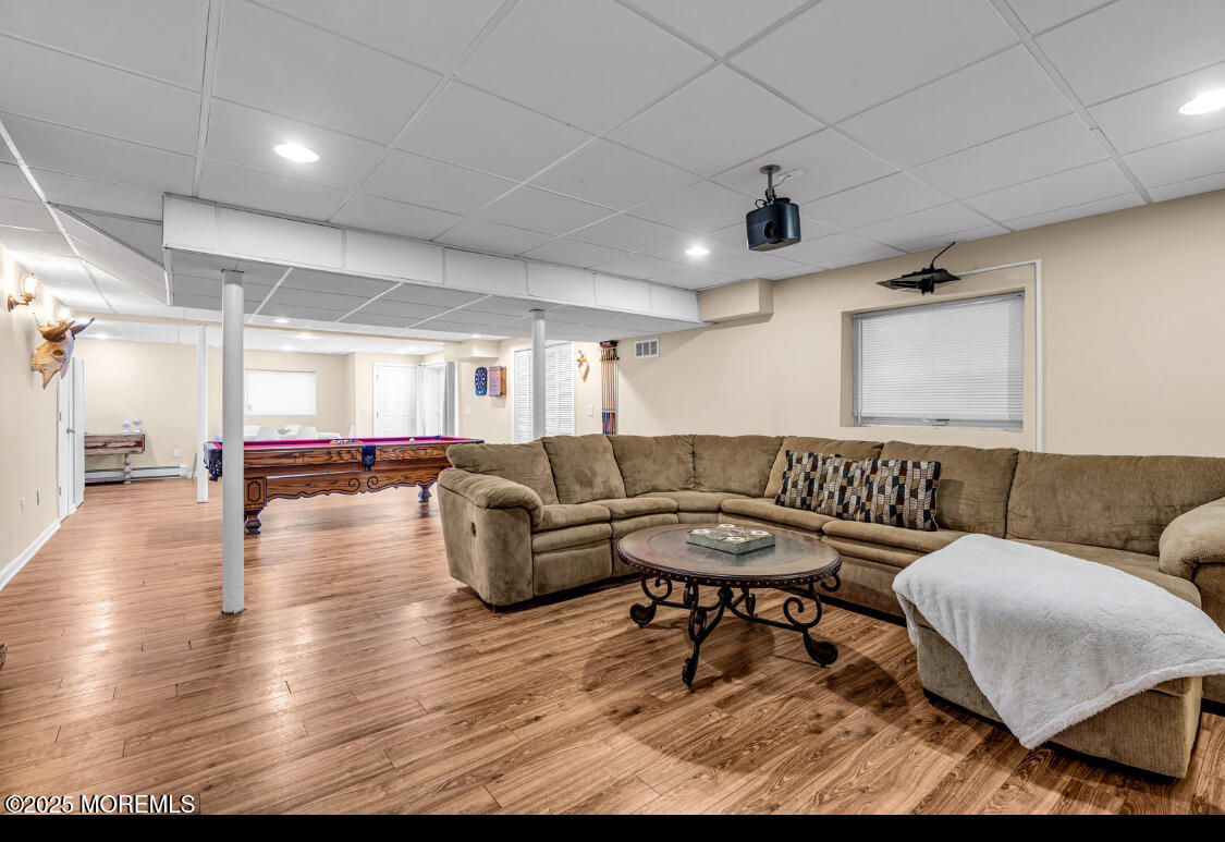 9 Mehar Court Jackson, NJ 08527 - Photo 25 of 40 a living room with furniture and wooden floor