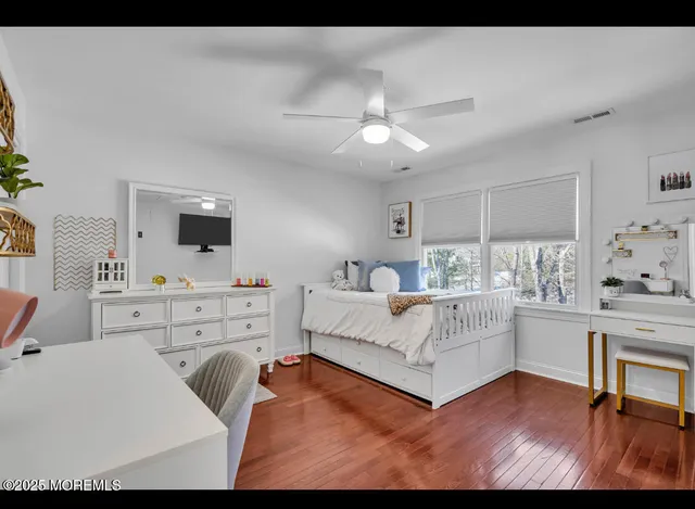 a living room with furniture and flat screen tv
