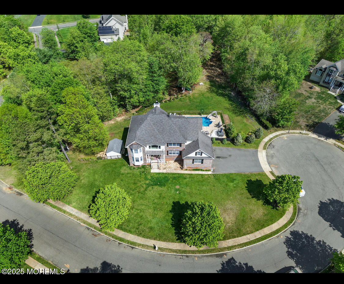 9 Mehar Court Jackson, NJ 08527 - Photo 34 of 40 a view of a garden with a fountain