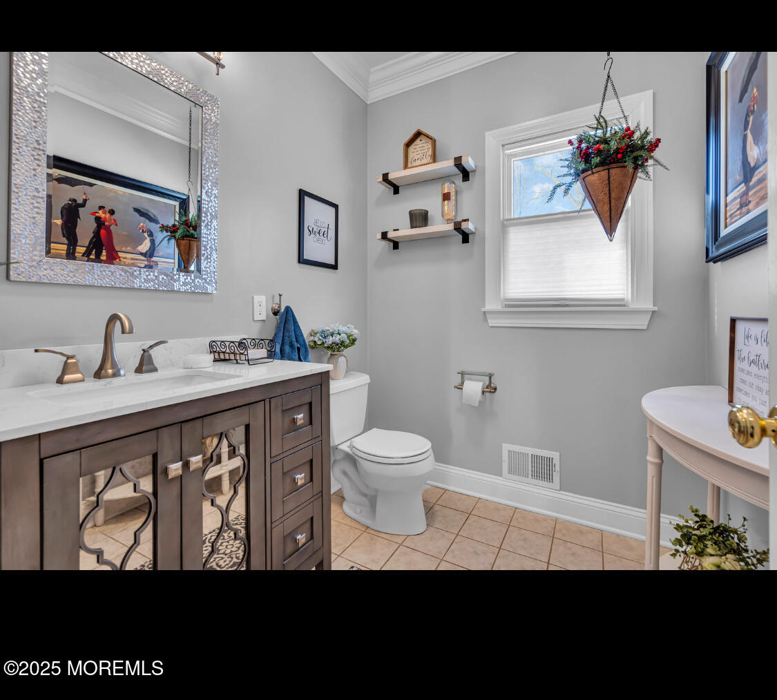 9 Mehar Court Jackson, NJ 08527 - Photo 5 of 40 a bathroom with a sink a mirror and a toilet