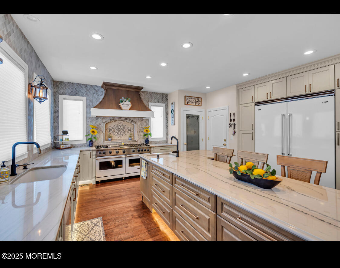 9 Mehar Court Jackson, NJ 08527 - Photo 7 of 40 a kitchen with stainless steel appliances granite countertop a sink counter space and a stove top oven