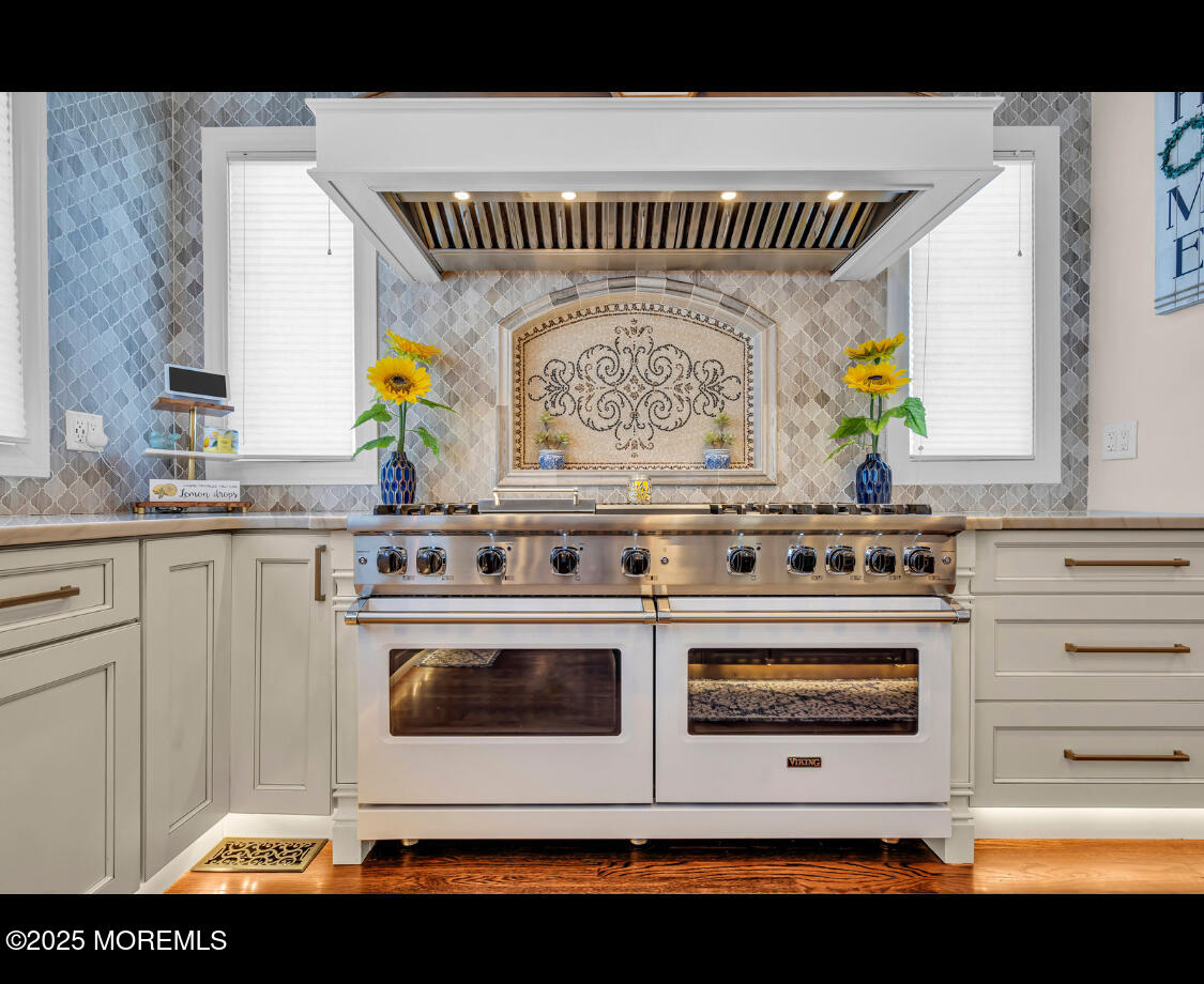 9 Mehar Court Jackson, NJ 08527 - Photo 10 of 40 a kitchen with a stove a microwave a sink and a window