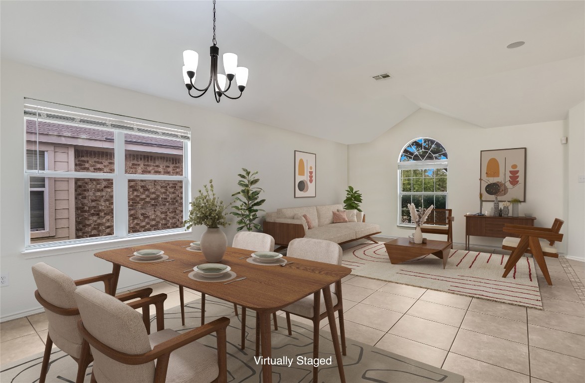 1901 Rachel Lane Round Rock, TX 78664 - Photo 11 of 35 Virtually Staged Dining space featuring light tile patterned flooring, vaulted ceiling, a chandelier, and baseboards
