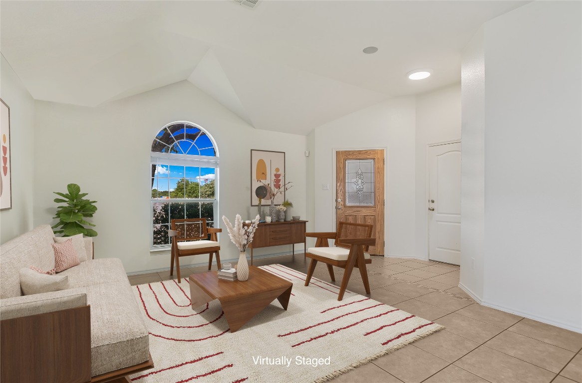1901 Rachel Lane Round Rock, TX 78664 - Photo 8 of 35 Virtually Staged Sitting room featuring light tile patterned flooring, lofted ceiling, and baseboards