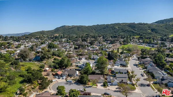 an aerial view of residential house and green space
