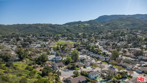 an aerial view of a residential houses and city view