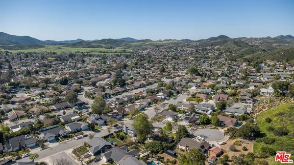 an aerial view of a house with outdoor space
