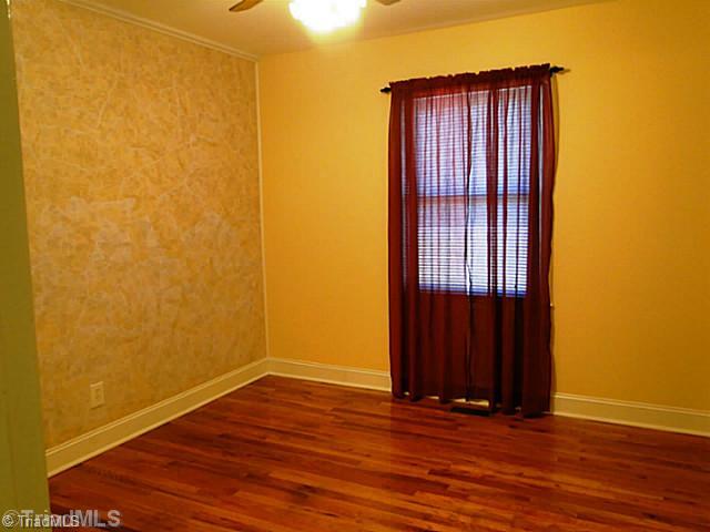 209 Hampton Drive High Point, NC 27265 - Photo 8 of 14 3rd Bedroom. Bedroom with wood floors and ceiling fan