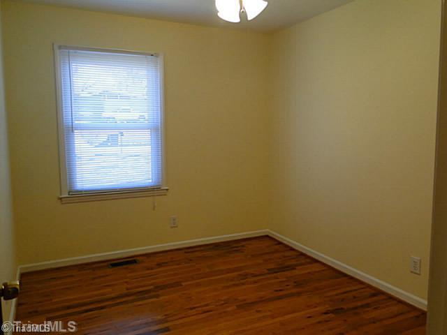 209 Hampton Drive High Point, NC 27265 - Photo 9 of 14 4th Bedroom. Bedroom with wood floors and ceiling fan