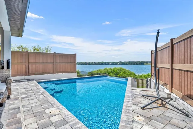 an aerial view of a house with a lake view