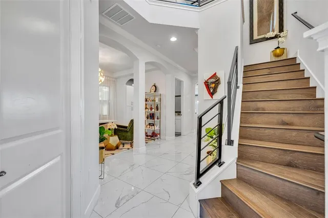 an aerial view of a house with outdoor space and lake view