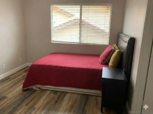 a close view of a sink and cabinets in a white cabinet