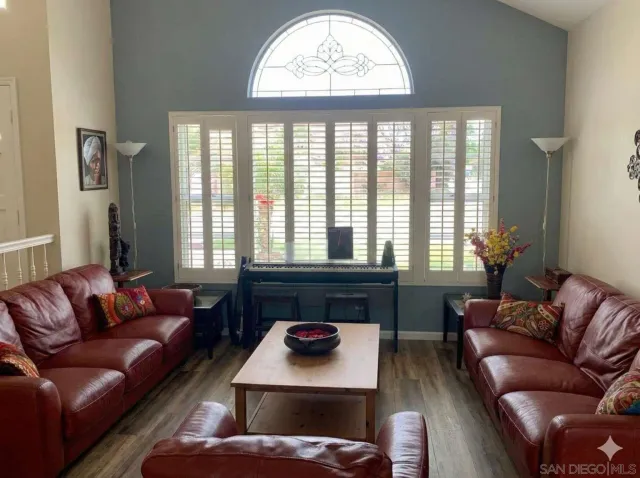 a bathroom with a double vanity sink a mirror and a bathtub