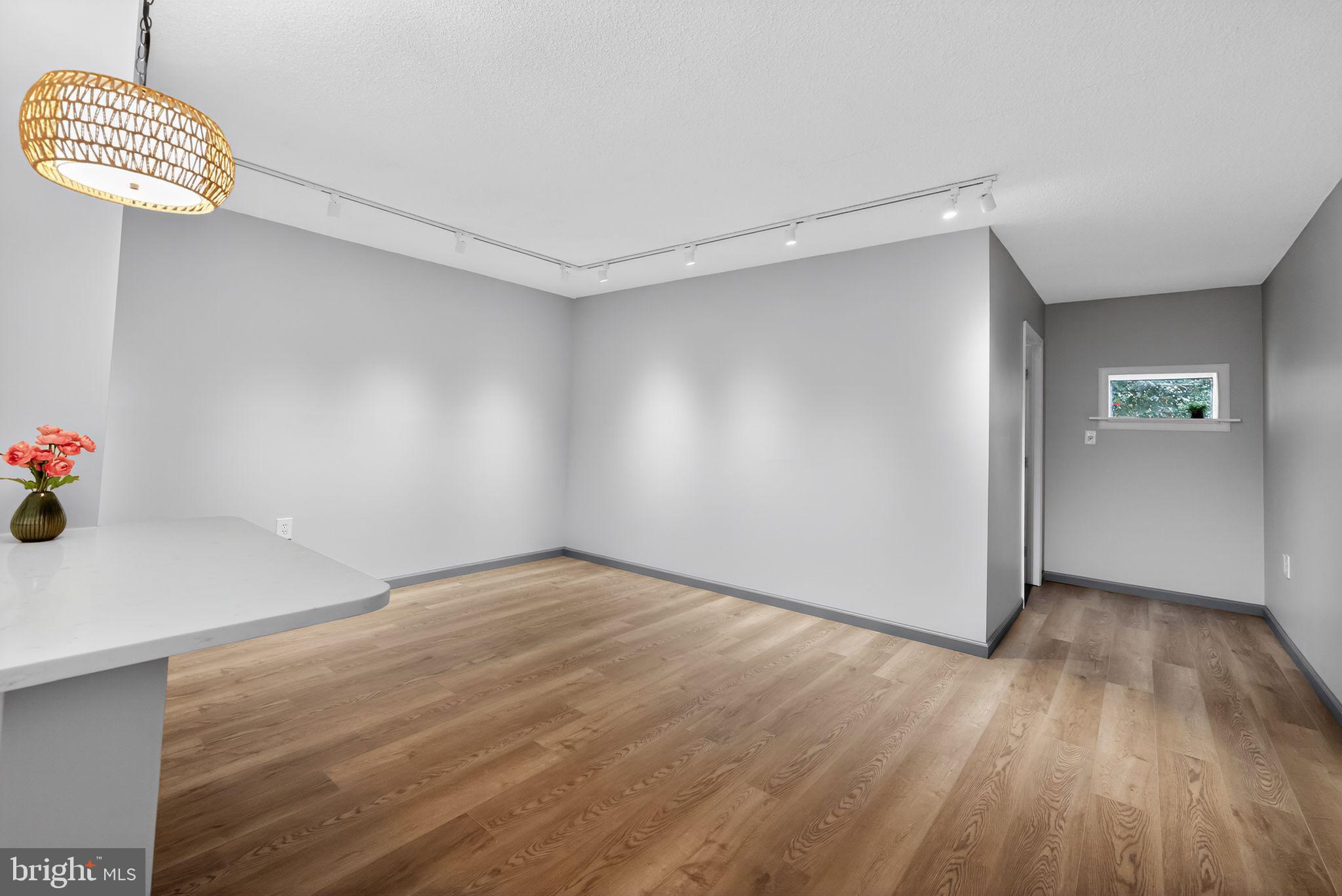 400 Glendale Road, Unit G33 Havertown, PA 19083 - Photo 12 of 26 a view of an empty room with wooden floor and a window
