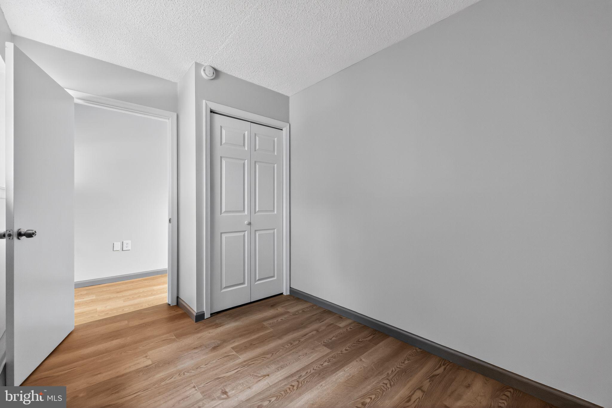 400 Glendale Road, Unit G33 Havertown, PA 19083 - Photo 15 of 26 a view of an empty room with wooden floor and closet