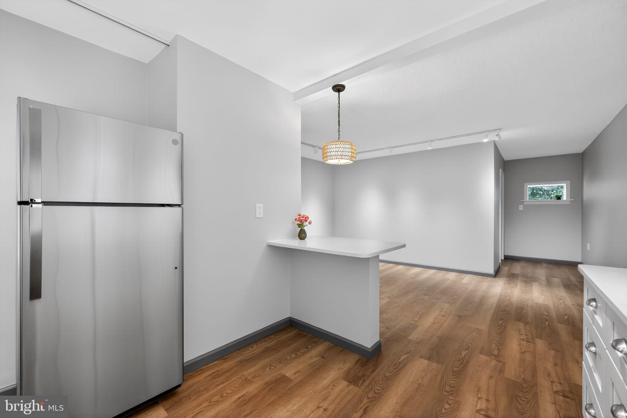 400 Glendale Road, Unit G33 Havertown, PA 19083 - Photo 5 of 26 a view of a kitchen with a refrigerator and a stove top oven