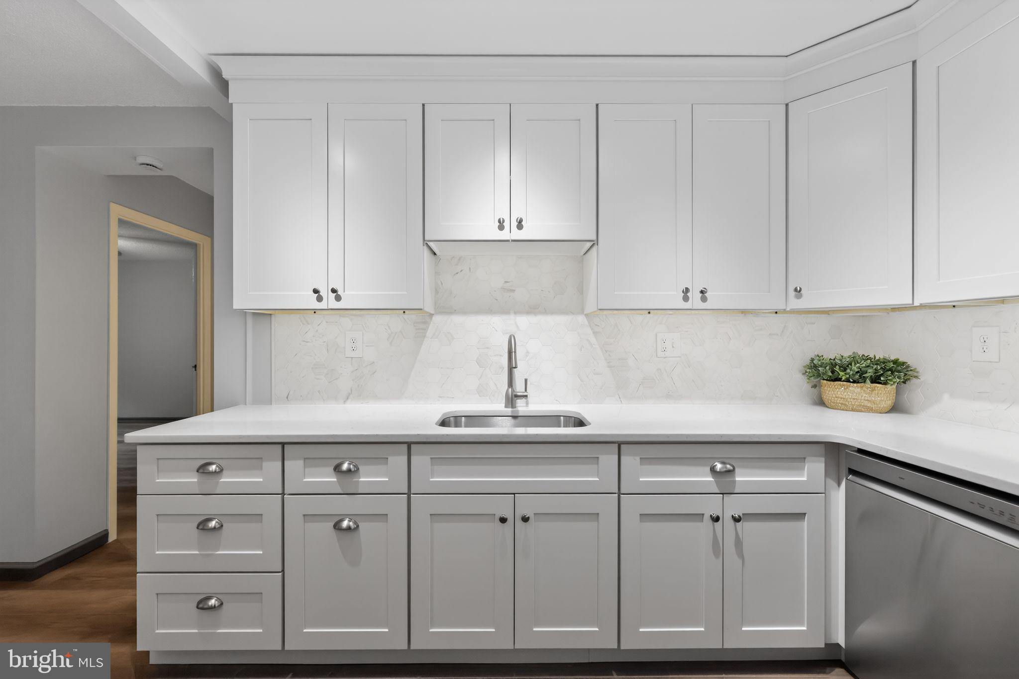 400 Glendale Road, Unit G33 Havertown, PA 19083 - Photo 7 of 26 a kitchen with white cabinets and a sink