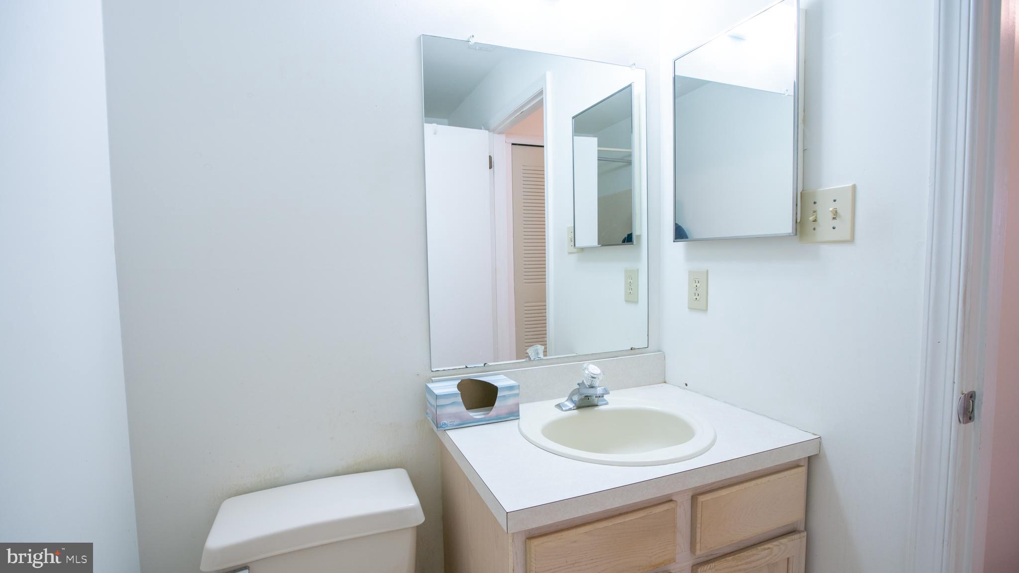 1403 Squirrel Road Marlton, NJ 08053 - Photo 18 of 21 a bathroom with a sink and a mirror