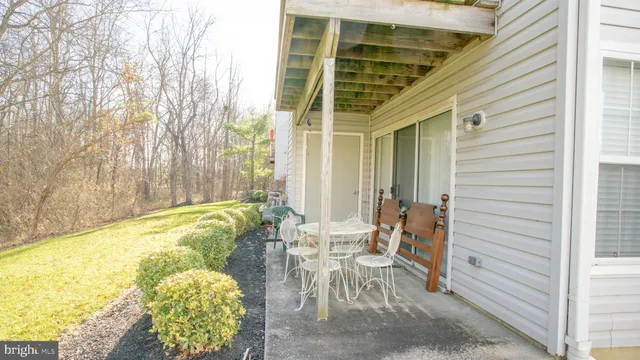 a view of balcony with furniture