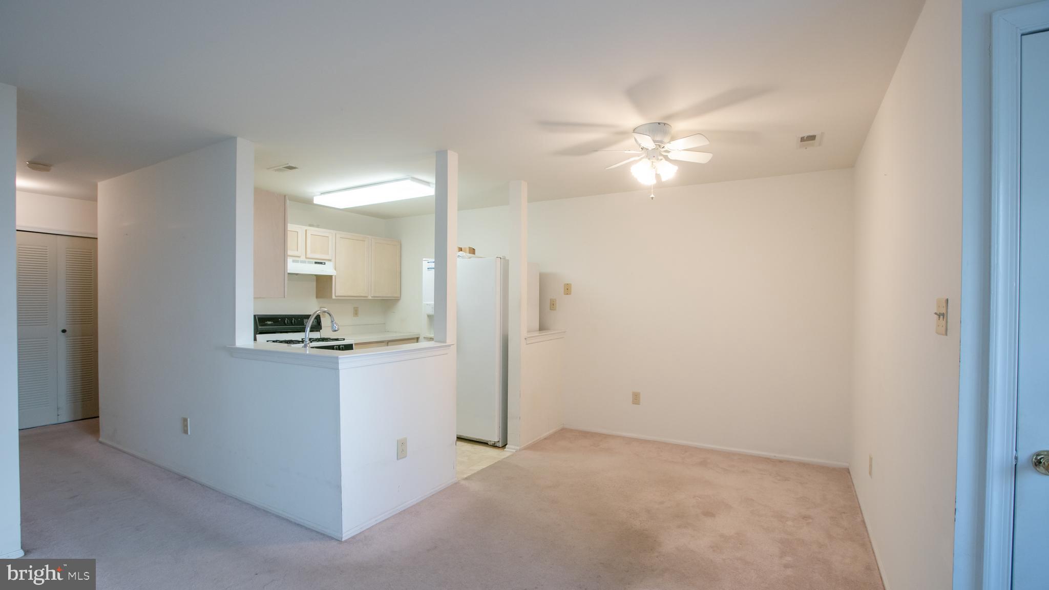 1403 Squirrel Road Marlton, NJ 08053 - Photo 10 of 21 a view of a kitchen with a sink and a refrigerator