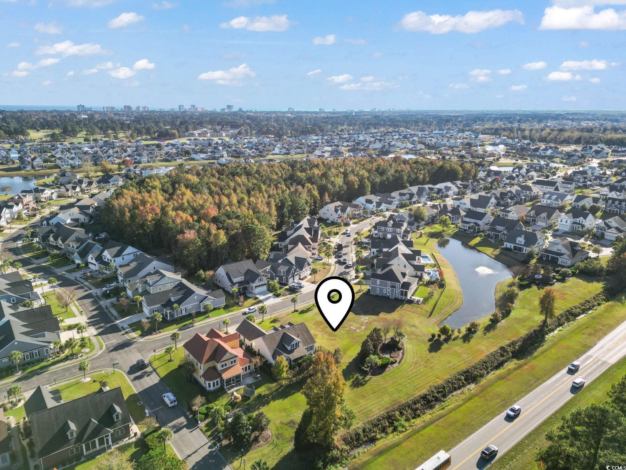 1103 East Isle Of Palms Avenue Myrtle Beach, SC 29579 - Photo 12 of 15 Aerial view of property's location featuring nearby suburban area and a large body of water