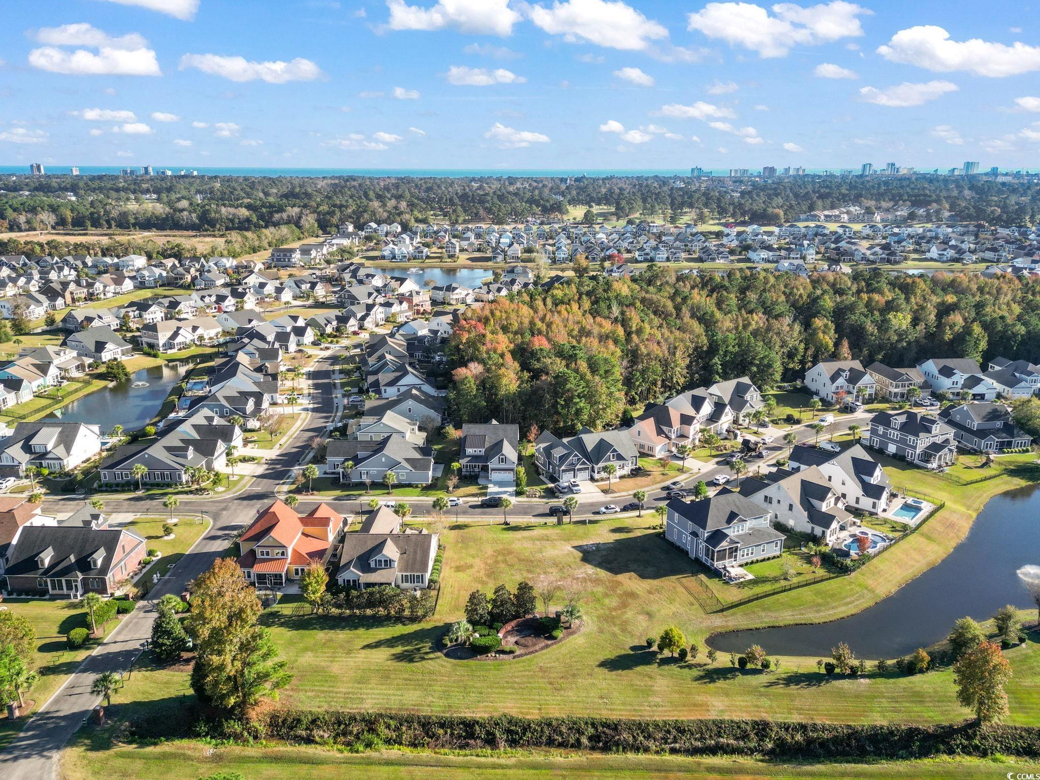 1103 East Isle Of Palms Avenue Myrtle Beach, SC 29579 - Photo 10 of 15 Aerial view of property's location with a nearby body of water and nearby suburban area
