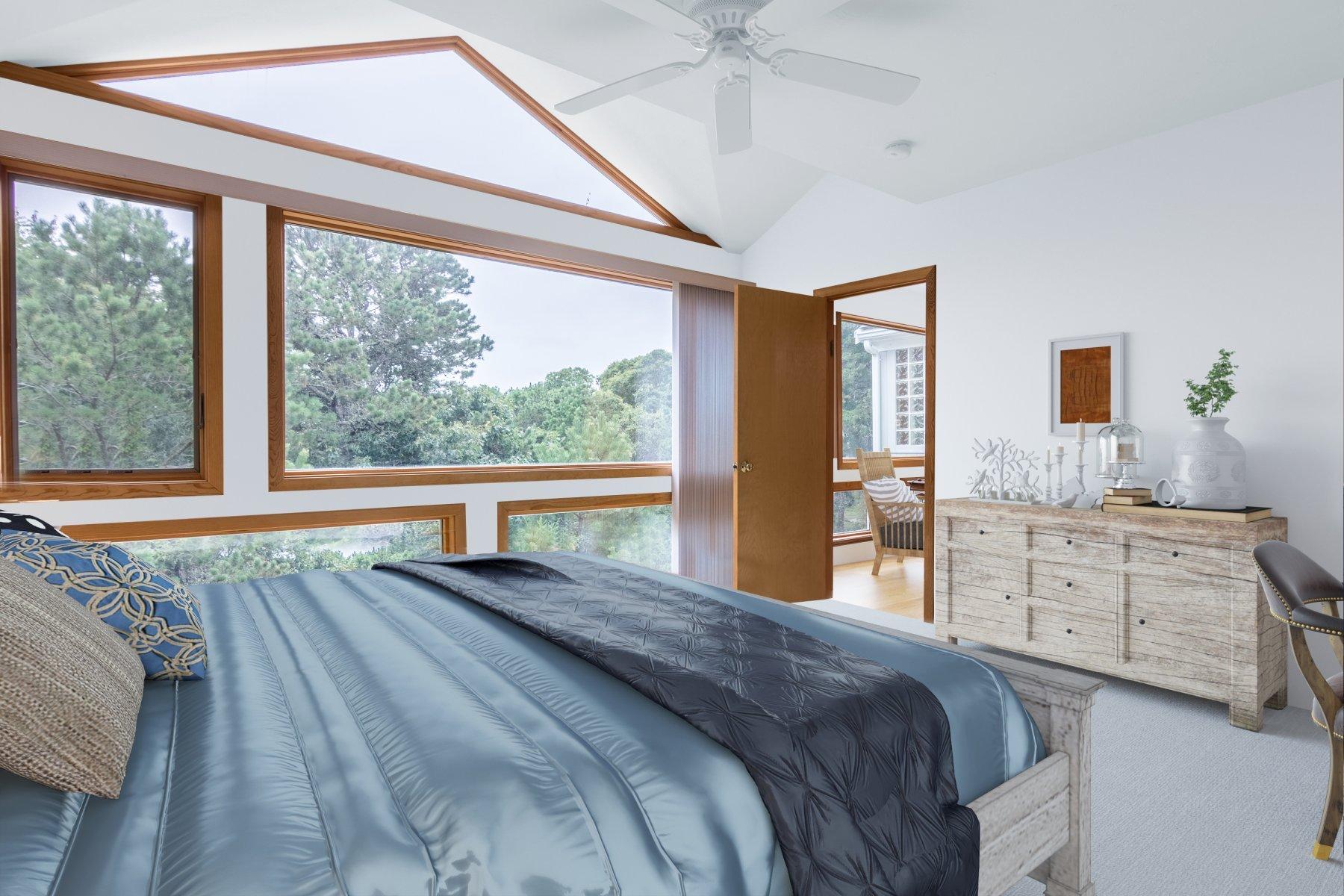 20 South Chatham Road Harwich, MA 02645 - Photo 18 of 35 a bedroom with a large bed and a large window