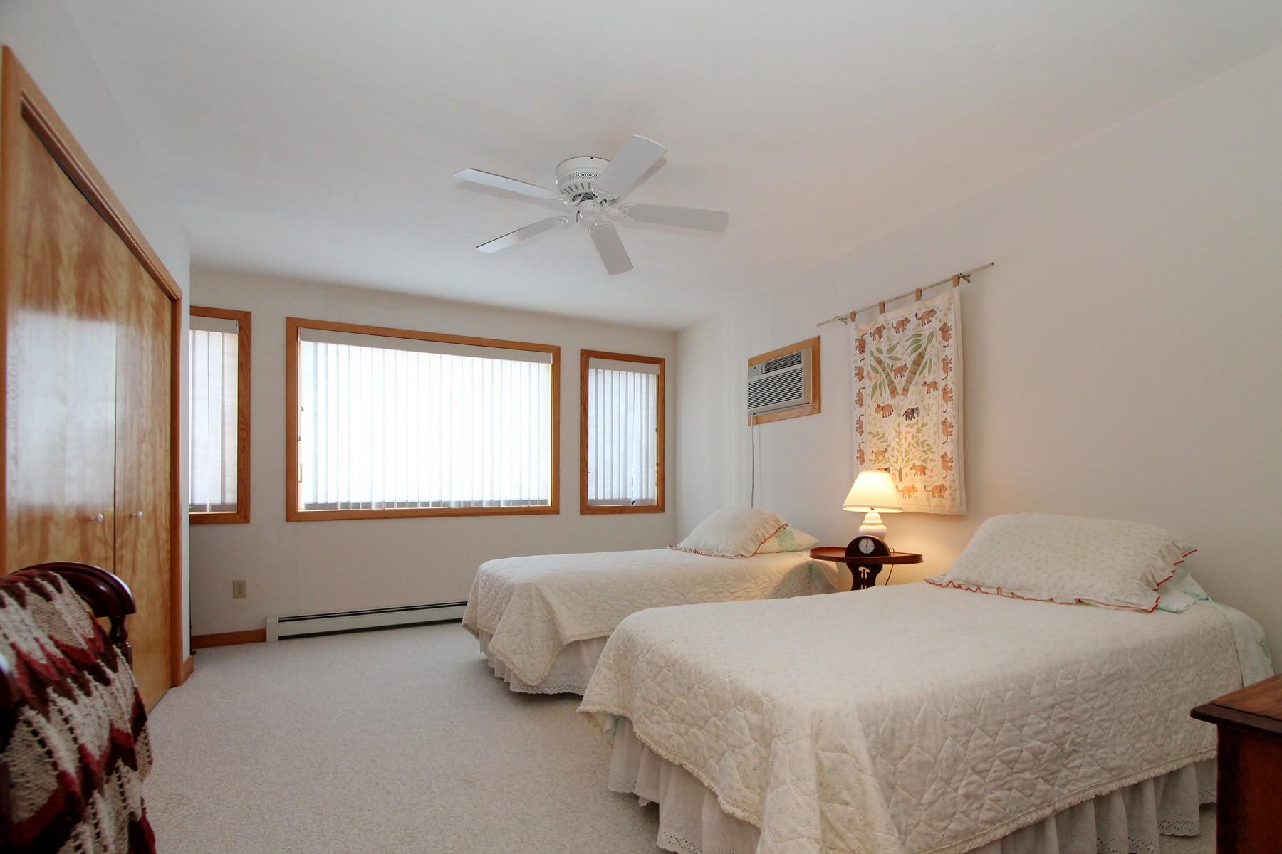 20 South Chatham Road Harwich, MA 02645 - Photo 20 of 35 a bedroom with a bed and a large window