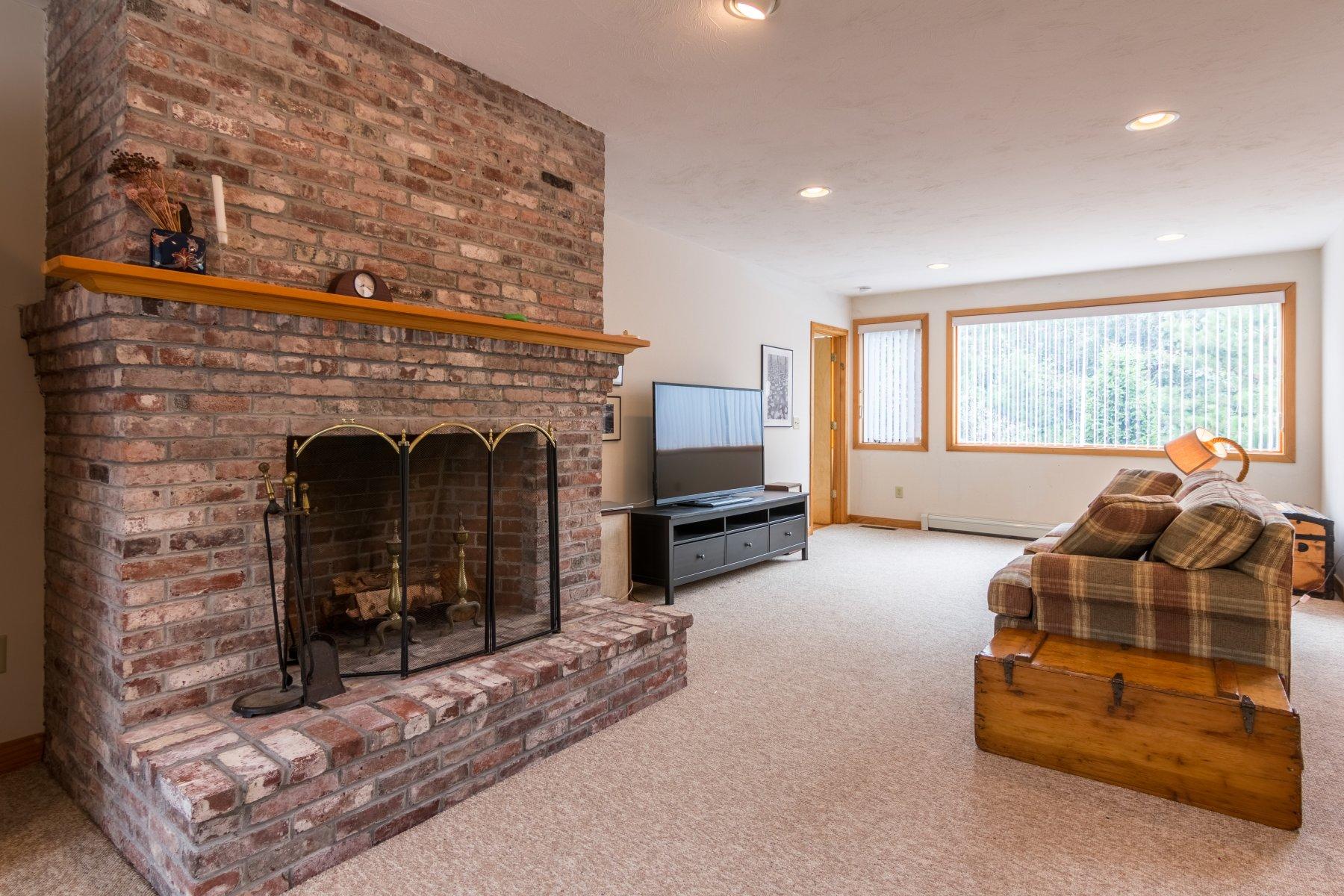 20 South Chatham Road Harwich, MA 02645 - Photo 22 of 35 a living room with furniture and a fireplace