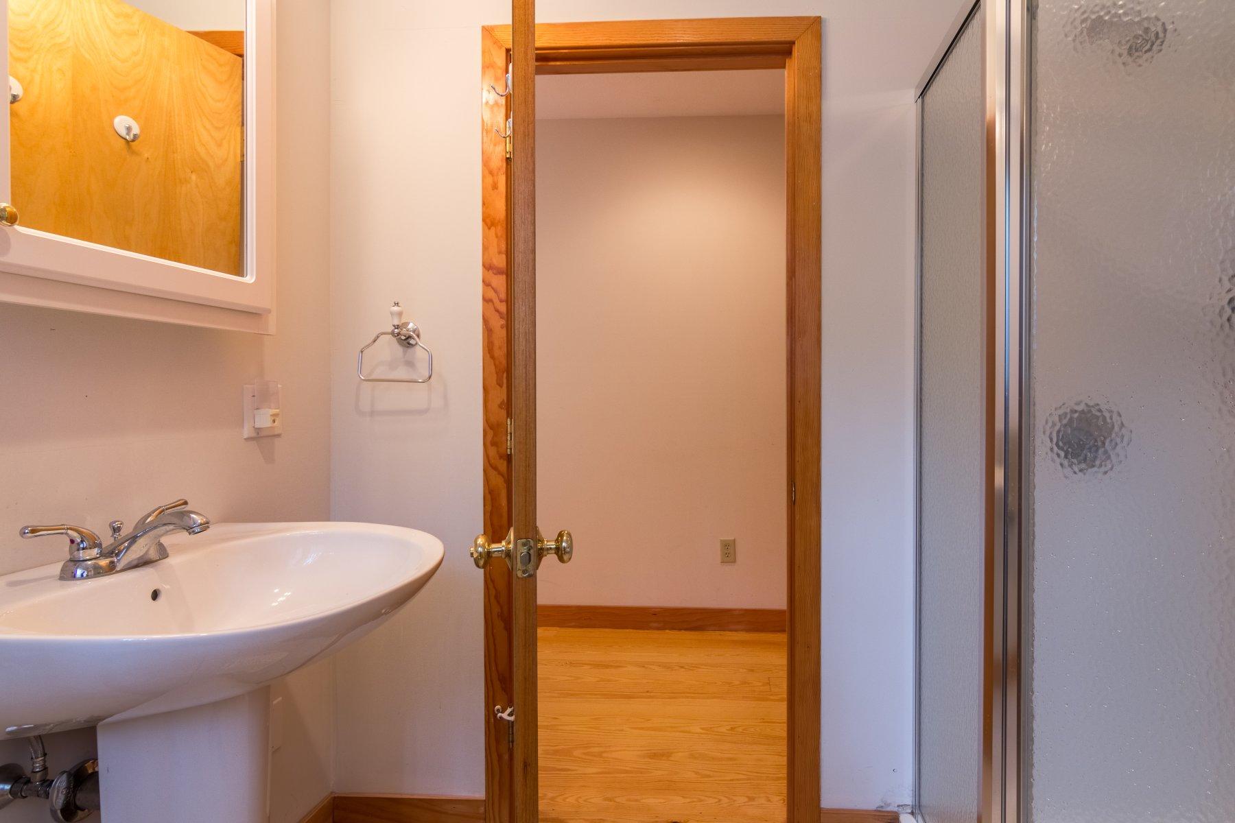 20 South Chatham Road Harwich, MA 02645 - Photo 23 of 35 a bathroom with a sink and a mirror