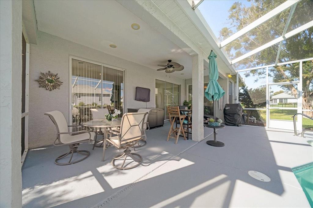 2197 Northwest 55th Avenue Road Ocala, FL 34482 - Photo 13 of 66 a work room with furniture a large window and glass door