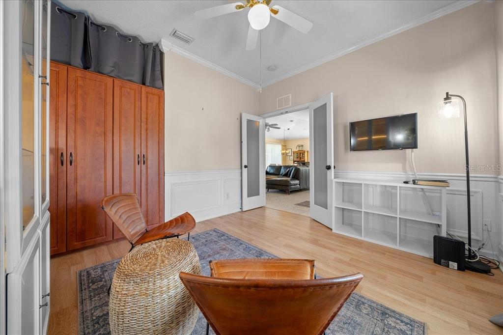 2197 Northwest 55th Avenue Road Ocala, FL 34482 - Photo 17 of 66 a living room with furniture and a flat screen tv