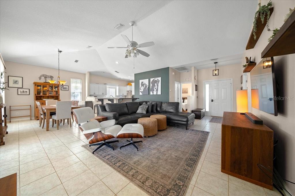 2197 Northwest 55th Avenue Road Ocala, FL 34482 - Photo 19 of 66 a living room with furniture and a flat screen tv