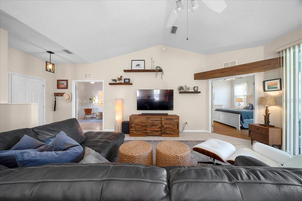 2197 Northwest 55th Avenue Road Ocala, FL 34482 - Photo 23 of 66 a living room with furniture and wooden floor
