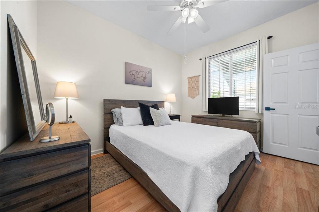 2197 Northwest 55th Avenue Road Ocala, FL 34482 - Photo 27 of 66 a bedroom with bed and a flat tv screen on dresser