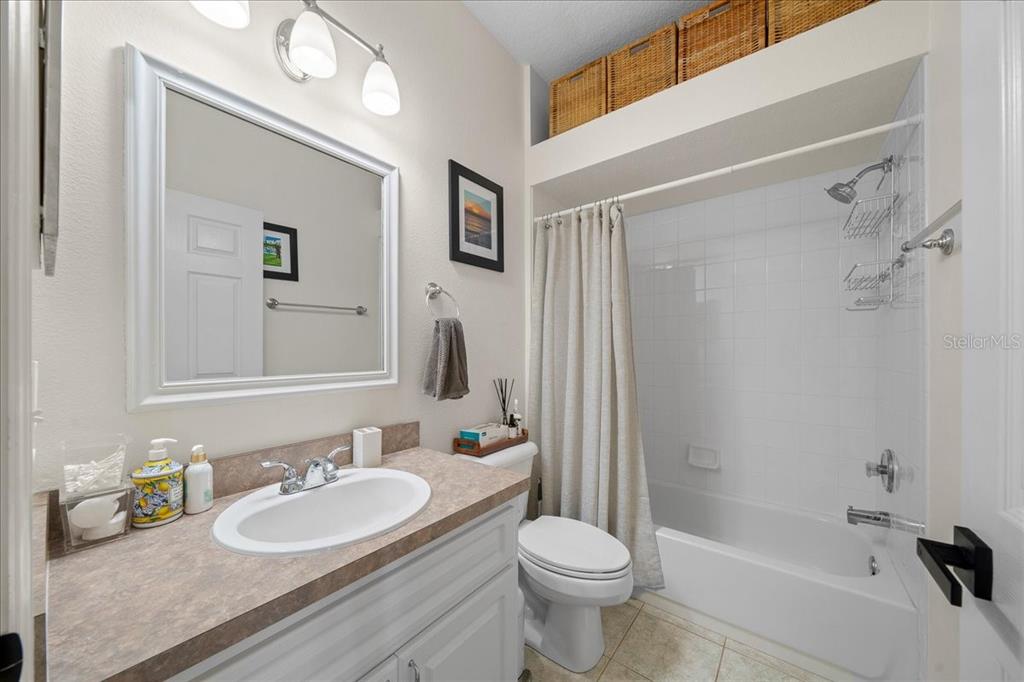 2197 Northwest 55th Avenue Road Ocala, FL 34482 - Photo 29 of 66 a bathroom with a sink a toilet and shower