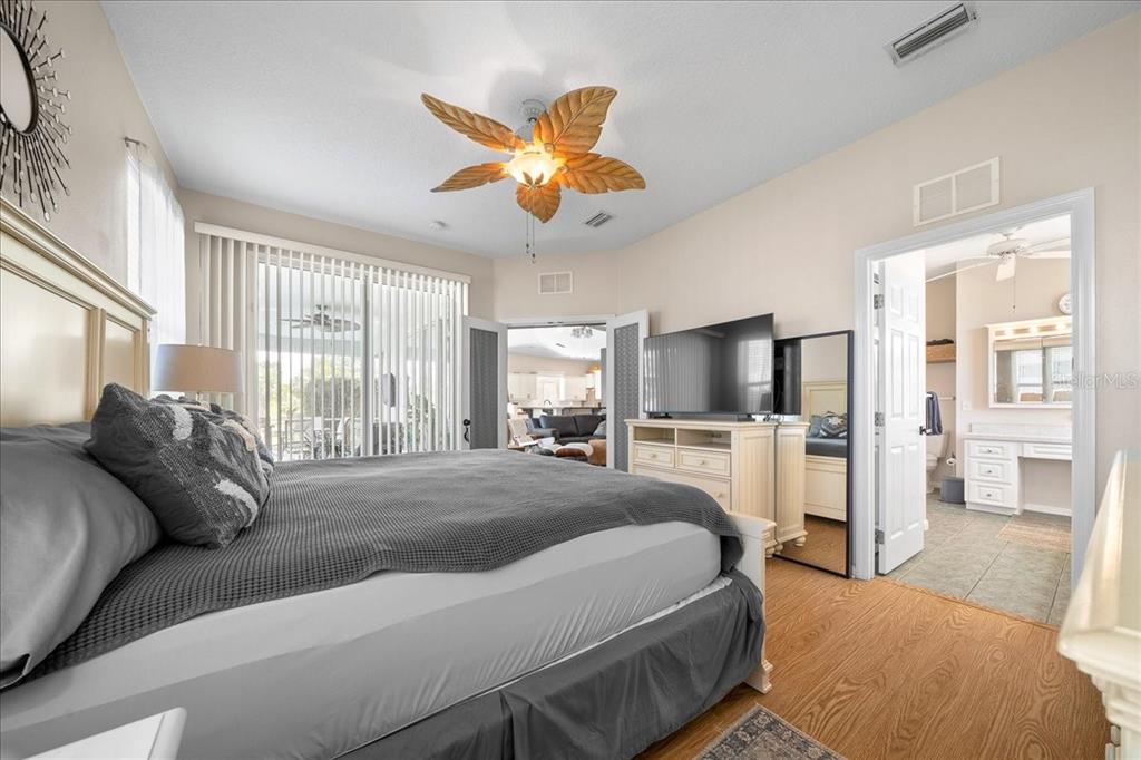 2197 Northwest 55th Avenue Road Ocala, FL 34482 - Photo 34 of 66 a bedroom with a bed and a large window