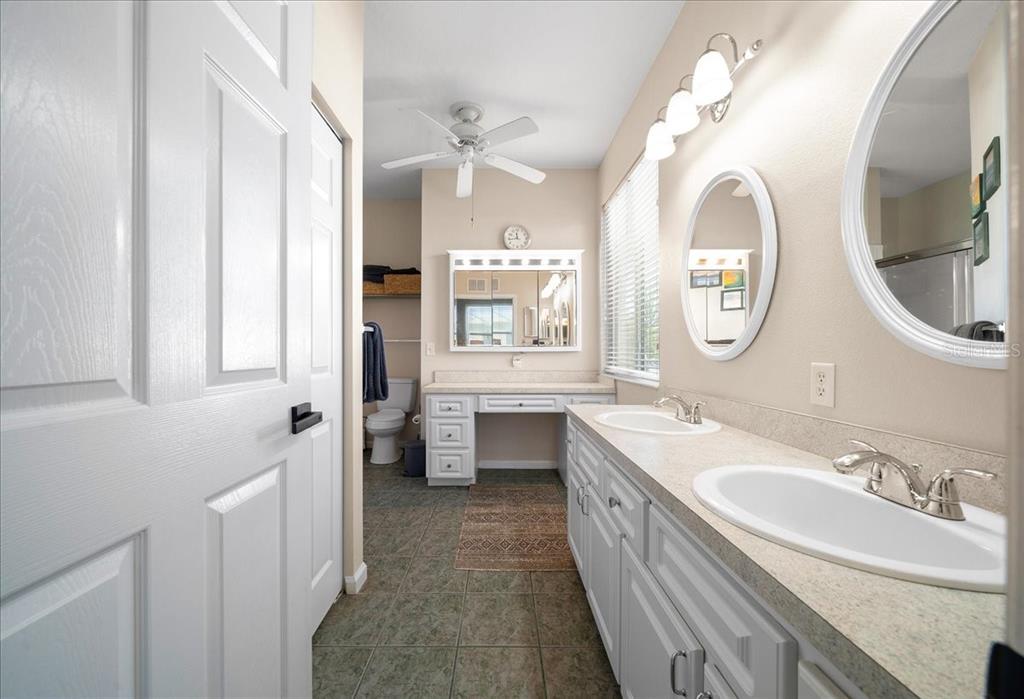 2197 Northwest 55th Avenue Road Ocala, FL 34482 - Photo 35 of 66 a spacious bathroom with a double vanity sink mirror and a bathtub