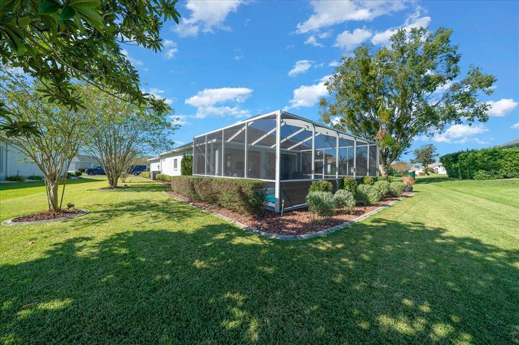 2197 Northwest 55th Avenue Road Ocala, FL 34482 - Photo 55 of 66 a view of a house with a yard