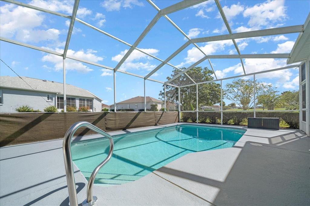 2197 Northwest 55th Avenue Road Ocala, FL 34482 - Photo 10 of 66 a view of a swimming pool with a patio