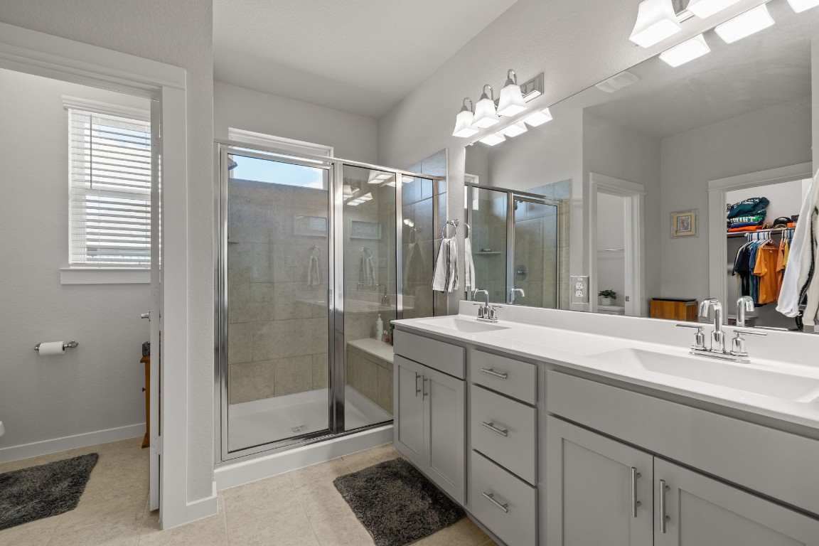1217 Red Hills Drive Rosharon, TX 77583 - Photo 14 of 25 a bathroom with a double vanity sink and mirror
